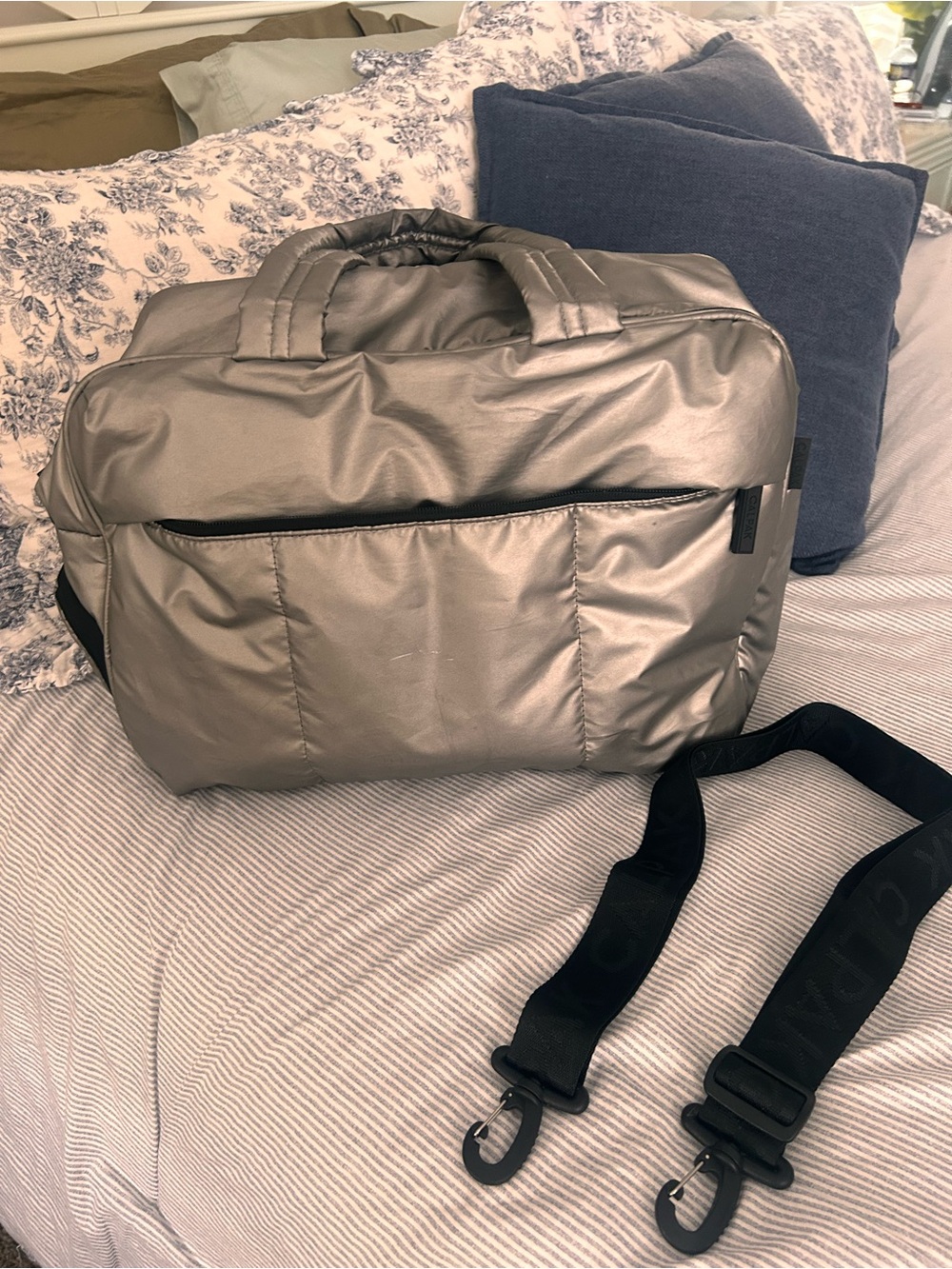 Calpak Metallic Silver Travel Bag with Black Strap